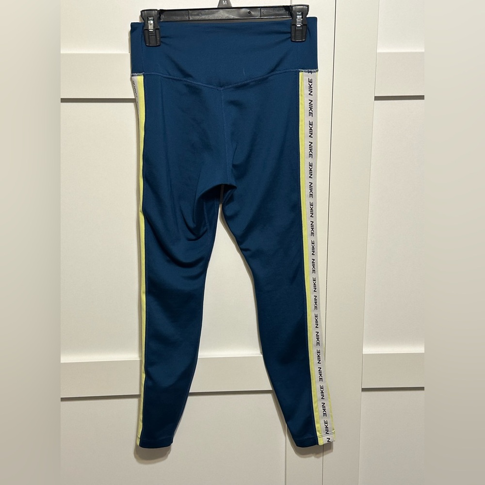 Nike leggings Blue with Nike detail down the legs. Medium